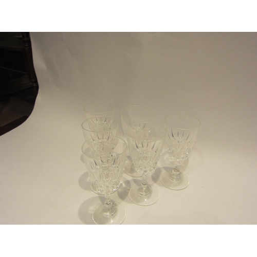 4443 - A set of six ruby glasses with twisted stems and six clear moulded glasses