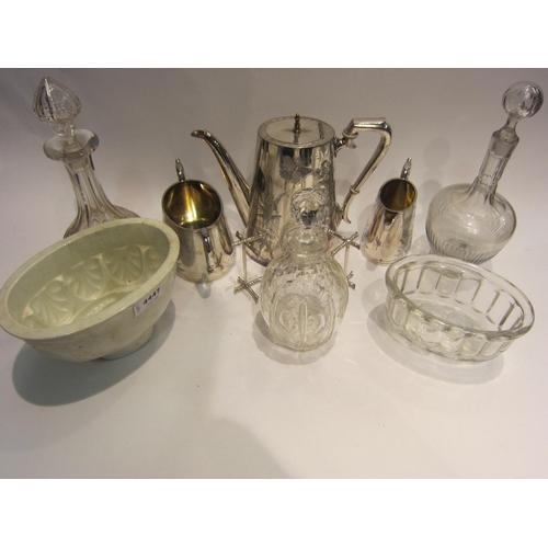 4447 - A mixed lot including cut glass decanters, jelly moulds, plated coffee pot, milk jug and sugar bowl