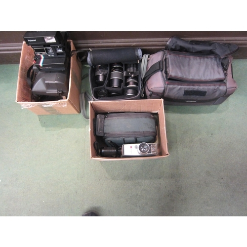 4317 - Two boxes and cases containing camera items to include cine cameras, Polaroid cameras and lenses