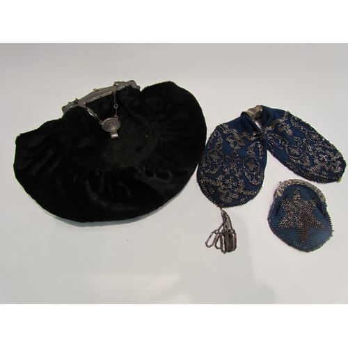 4406 - A velvet evening bag with silver frame, Birmingham, a blue steel beaded miser purse and a similar ex... 