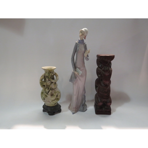 4292 - A Lladro figure, 35cm tall, carved soapstone vase, 21cm tall, and a carved wood figurine, 25cm tall ... 