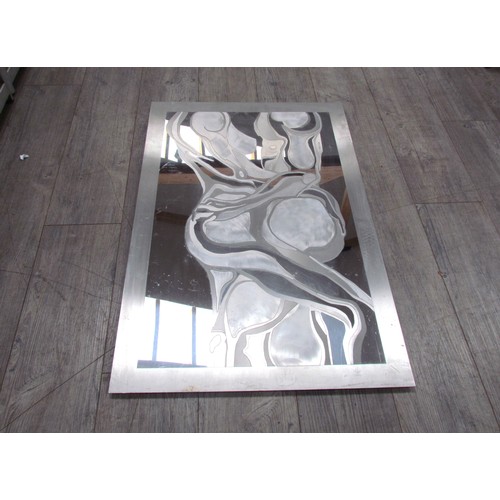 2386 - A circa 1970's abstract wall mirror with brushed metal silhouette relief intertwined couple. 93cm x ... 