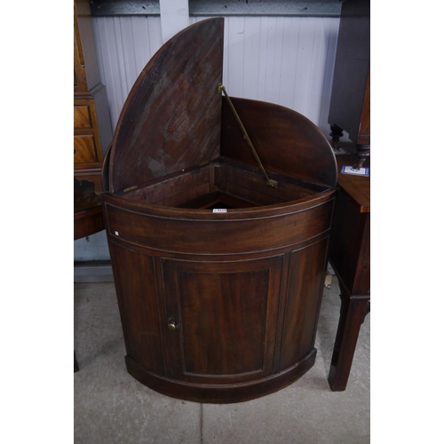 2120 - A Georgian mahogany campaign corner cupboard