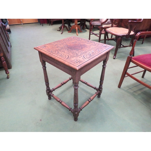 4220 - An oak carved top occasional table on turned supports, 62cm tall x 48cm wide