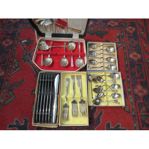 4250 - A box of cutlery including cased sets