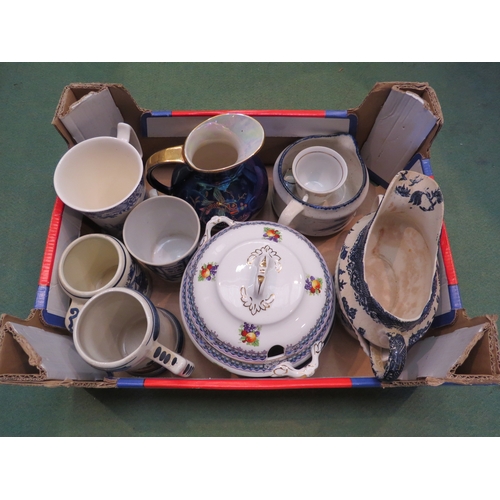 4255A - A collection of blue and white ceramics including two gravy boats and mugs together with a tureen an... 