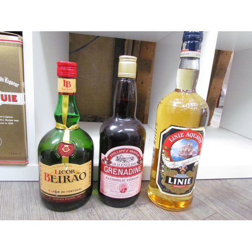 9100 - A box of mixed spirits including Licor Beirao, Linie Aquavit, Grenadine, Kwan Phayao and a selection... 