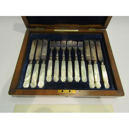 4006 - A burr walnut cased set of six Mappin & Webb knives and forks, engraved electroplated blades, mother... 