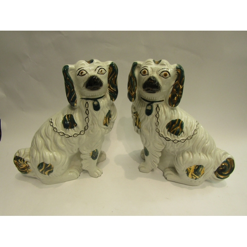 4012 - A pair of 19th Century Staffordshire dogs, green and gilt detail, 30cm tall  (R)_ £30