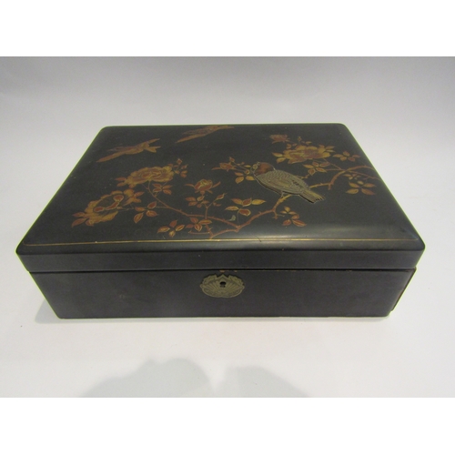 4014 - An Oriental lacquer box, top embossed with birds in apple blossom, 23cm x 33cm