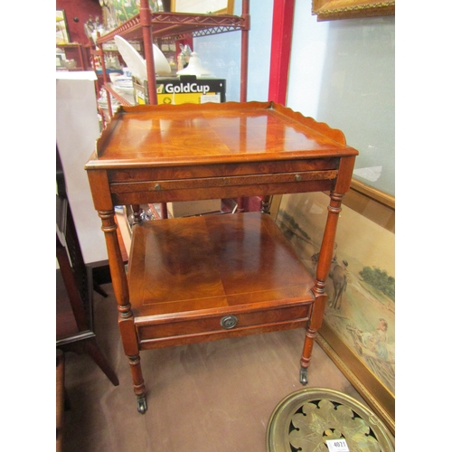 4015 - A pair of burr walnut side tables, two tier with brushing slides and drawer on brass castors, scratc... 