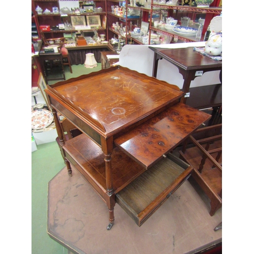 4015 - A pair of burr walnut side tables, two tier with brushing slides and drawer on brass castors, scratc... 