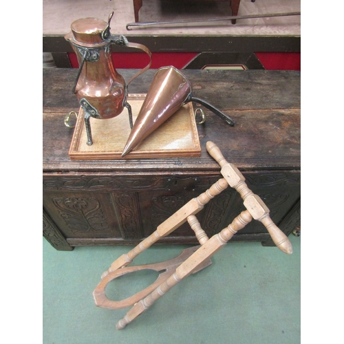 4017 - A conical copper ale warmer, jug on tripod legs, a boot remover and an oak tray with brass handles (... 