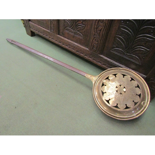 4021 - A 17th Century engraved brass bed pan with flat iron handle and copper rivets  (R)   £40