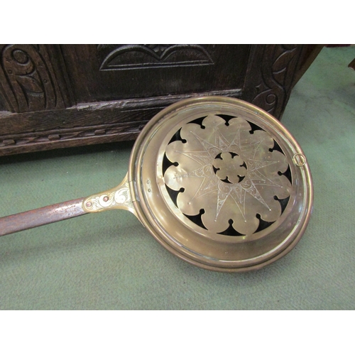 4021 - A 17th Century engraved brass bed pan with flat iron handle and copper rivets  (R)   £40