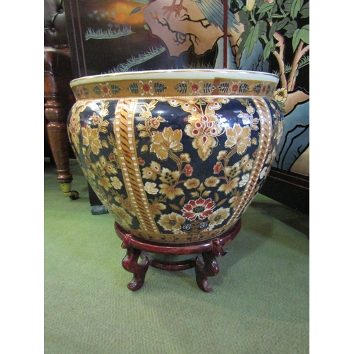 4033 - An Oriental jardiniere / goldfish bowl on stand, floral design, 32cm diameter x 33cm tall including ... 