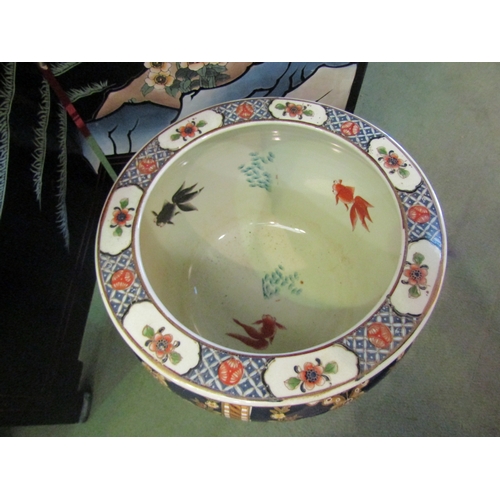 4033 - An Oriental jardiniere / goldfish bowl on stand, floral design, 32cm diameter x 33cm tall including ... 