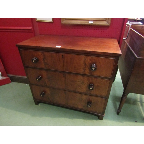 4068 - A circa 1850 chest of three graduating long drawers with mother-of-pearl inlaid turned handles over ... 