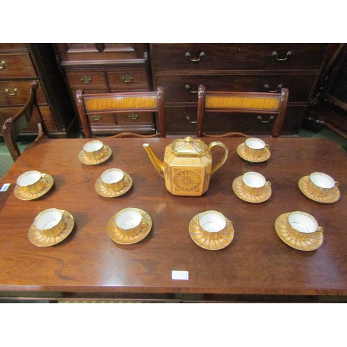 4069 - A peach ground gilt decorated part tea set comprising of teapot, ten cups and ten saucers