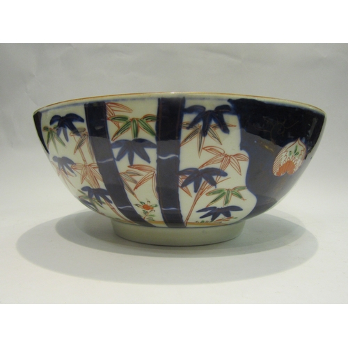 4078 - An Oriental footed bowl decorated in the Imari palette, 31cm diameter (chip to rim as well as a star... 