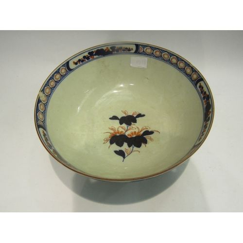 4078 - An Oriental footed bowl decorated in the Imari palette, 31cm diameter (chip to rim as well as a star... 