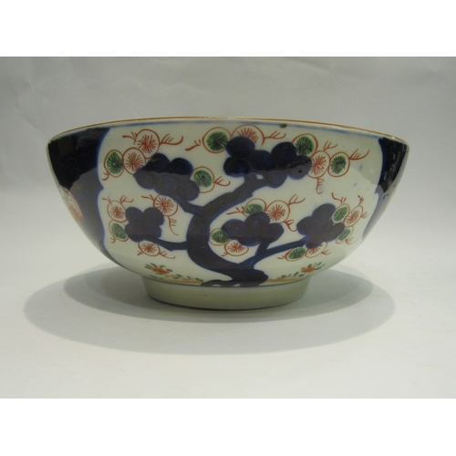 4078 - An Oriental footed bowl decorated in the Imari palette, 31cm diameter (chip to rim as well as a star... 