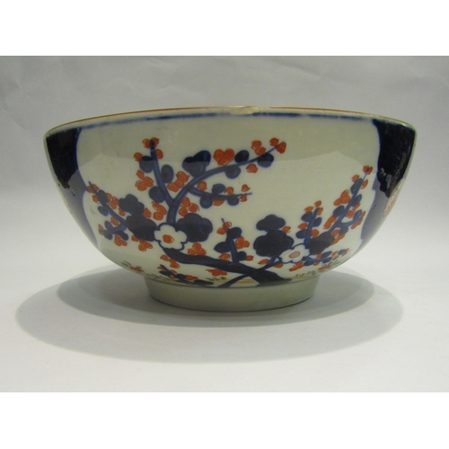 4078 - An Oriental footed bowl decorated in the Imari palette, 31cm diameter (chip to rim as well as a star... 