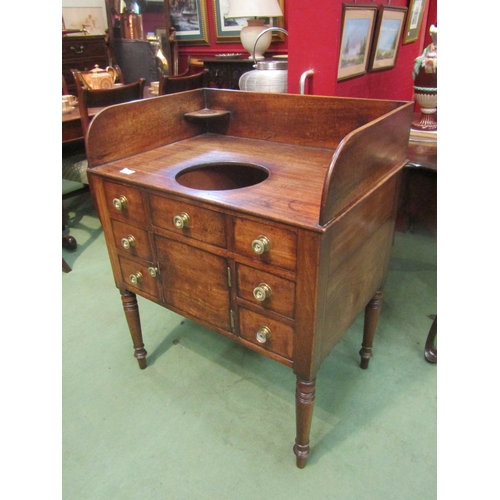 4079 - A George III mahogany gentleman's washstand with two drawer, cupboard door and five faux drawer fron... 