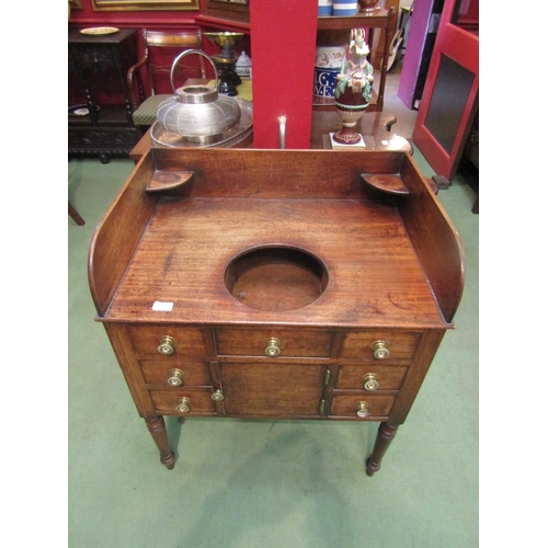 4079 - A George III mahogany gentleman's washstand with two drawer, cupboard door and five faux drawer fron... 