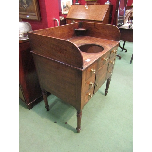 4079 - A George III mahogany gentleman's washstand with two drawer, cupboard door and five faux drawer fron... 