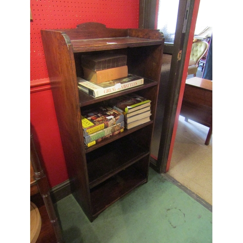 4095 - An oak four tier bookshelf with raised gallery, 118cm tall x 56cm wide x 29cm deep