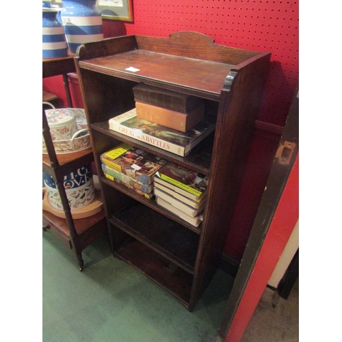 4095 - An oak four tier bookshelf with raised gallery, 118cm tall x 56cm wide x 29cm deep