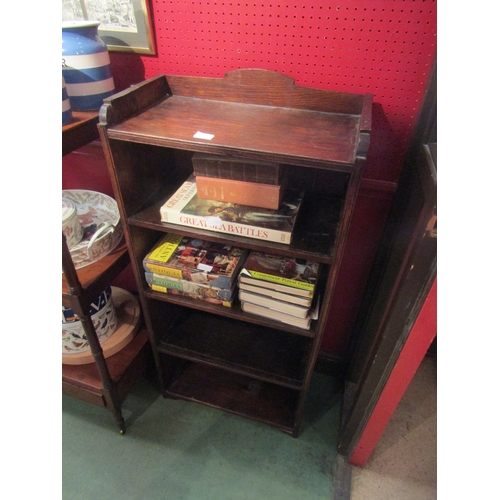 4095 - An oak four tier bookshelf with raised gallery, 118cm tall x 56cm wide x 29cm deep