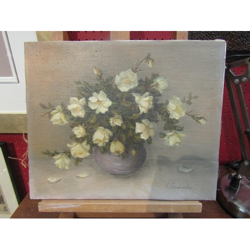 4104 - E.WEREZYNSKA: An oil on canvas still-life of flowers in vase.  Signed lower right. 27cm x 33cm