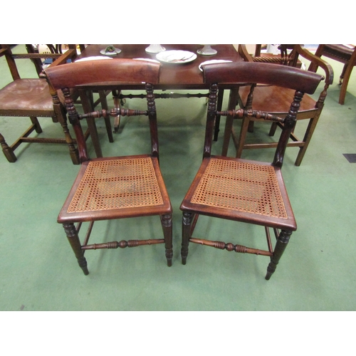 4117 - A pair of early Victorian ash and elm cane seat chairs with turned and fluted central bar back on tu... 