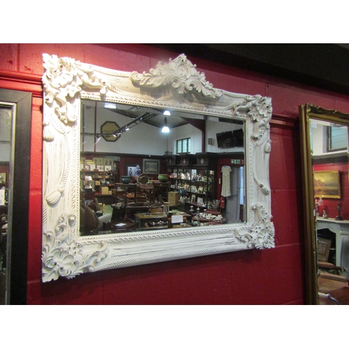 4135 - A modern French style white painted classical wall mirror with bevelled glass, 64cm x 76cm