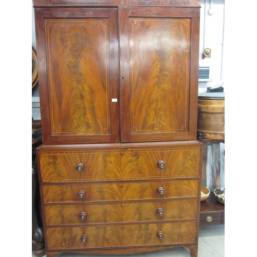 2084 - A Georgian mahogany linen cupboard top to secrataire chest base