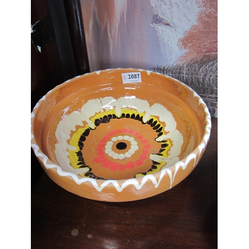 2087 - A peach, yellow and black glazed bowl