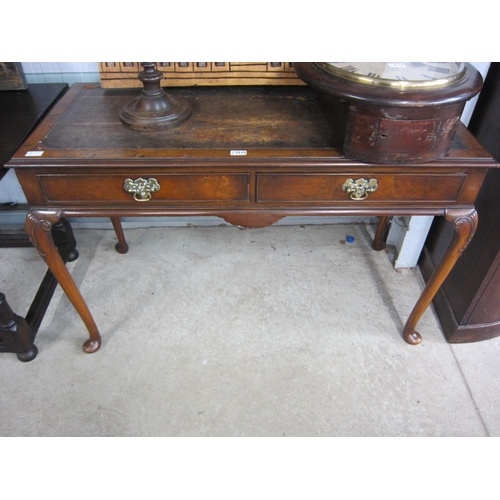 2115 - A walnut writing desk, leather top a/f, twin frieze drawers, carved knees to pad feet, for renovatio... 