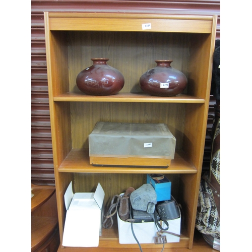 2394 - A 1970's teak three tier bookshelf   (E) £8-12