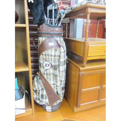 2398 - A 1970's set of golf clubs in classy carpet bag