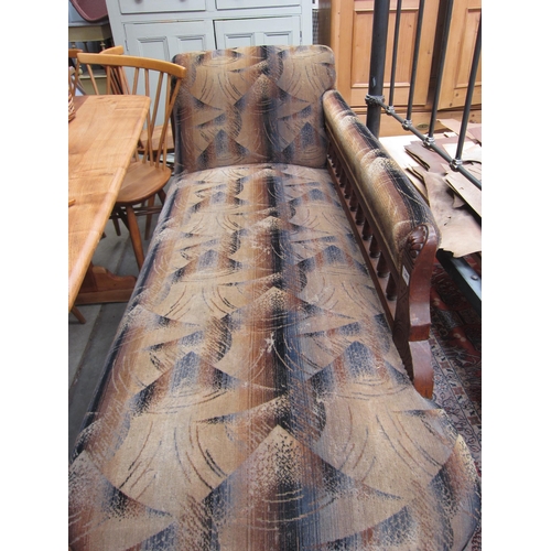 2441 - An Edwardian oak chaise longue