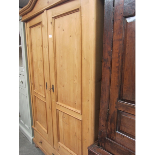 2445 - A 19th Century French pine wardrobe / armoire, two doors, raised on pad feet