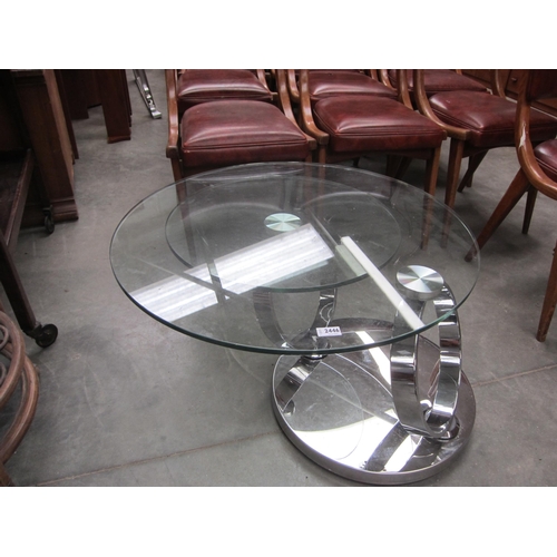 2446 - A glass and chrome Swirl coffee table