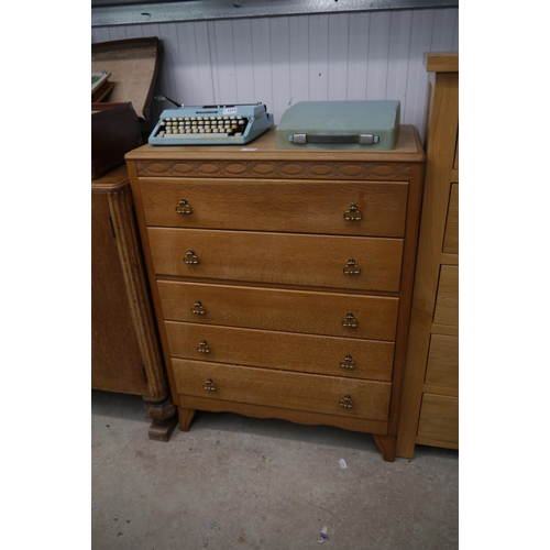 2374 - An oak chest of five drawers