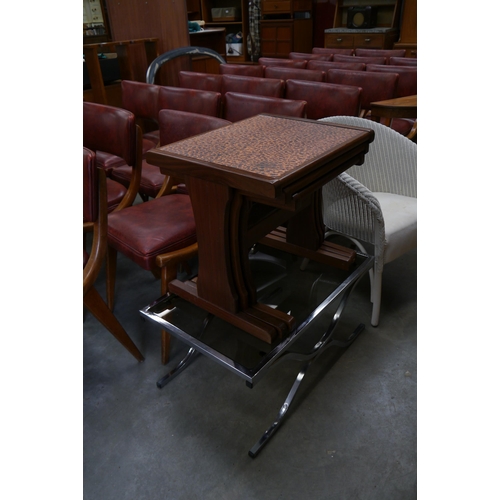 2420 - A teak nest of three fitting tables with a copper top and chrome and glass top coffee table