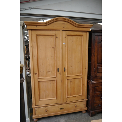 2445 - A 19th Century French pine wardrobe / armoire, two doors, raised on pad feet