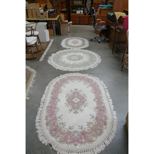 2449 - Three circular lounge rugs