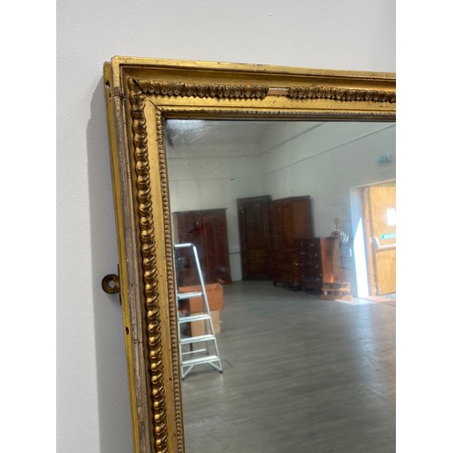 6048 - A gilt pier mirror, some gesso missing, 179cm x 99cm