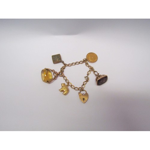 1107 - A metal charm bracelet with a 9ct gold padlock, 1906 gold half-sovereign, a 9ct gold swivel centre f... 